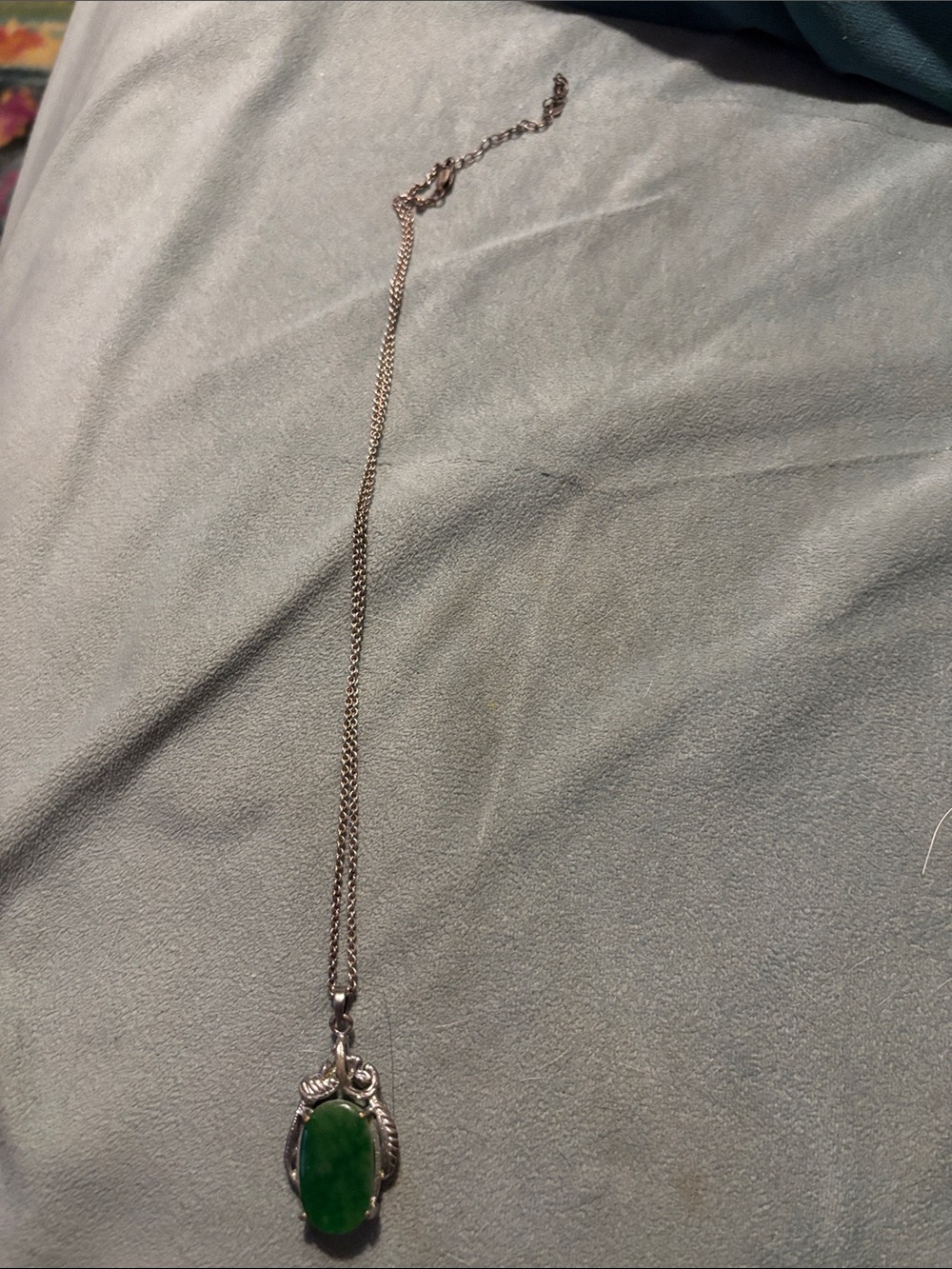 Silver chain and green jade pendant
